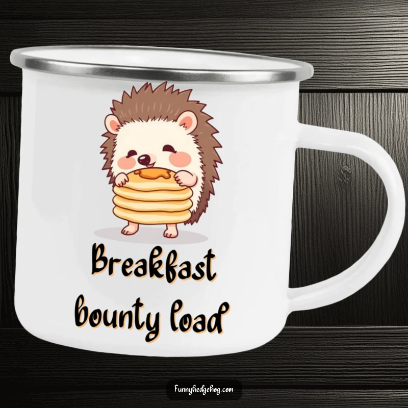 Funny camping mug with a determined hedgehog balancing pancakes, ready for a comical outdoor breakfast.