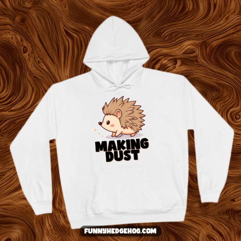 Funny hoodie showing a hedgehog shape in mid-spin with a trail of glittering dust, designed for comfort and a touch of magic.